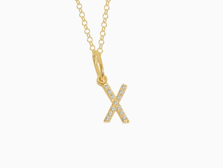 Dije en oro amarillo de 18K letra X full brillantes Fashion